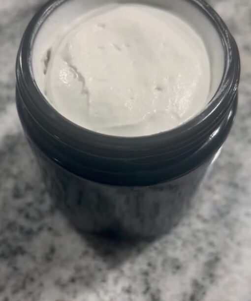 Open jar of Inked Up tattoo cream showing its whipped texture